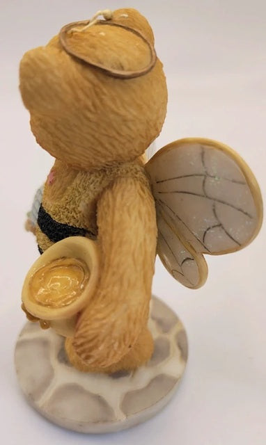 Teddy bear bee figurine with wings on a white background