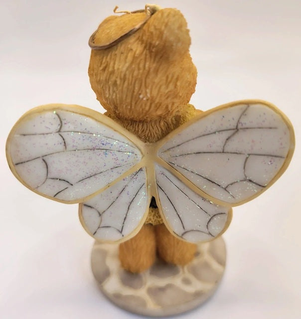 Teddy bear with bee wings on a white background