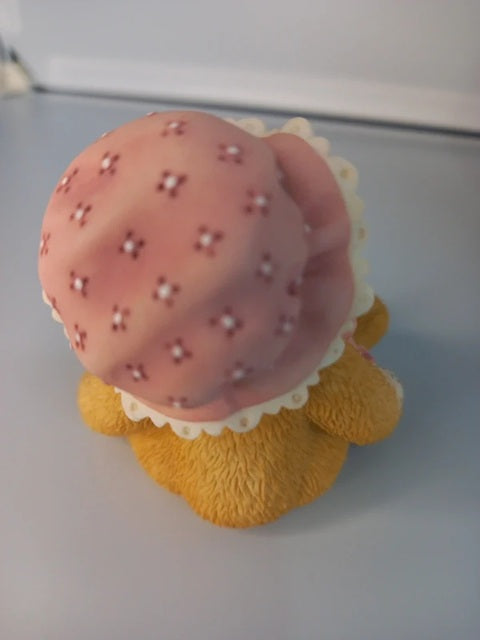 Toy resembling a strawberry shortcake on a plain background