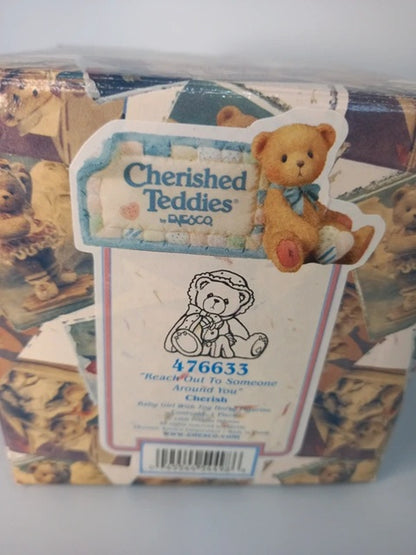 Packaged Cherished Teddies toy with a visible label on a white background
