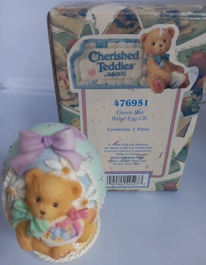 Cherished Teddies collectible bear figurine with packaging on a light blue background