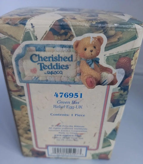 Box packaging of a teddy bear with 'Cherished Teddies' branding on a light gray background.
