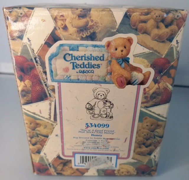Box of Cherished Teddies with teddy bear illustrations and text.