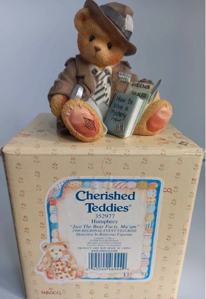 Cherished Teddies bear figurine on a box with a gray background