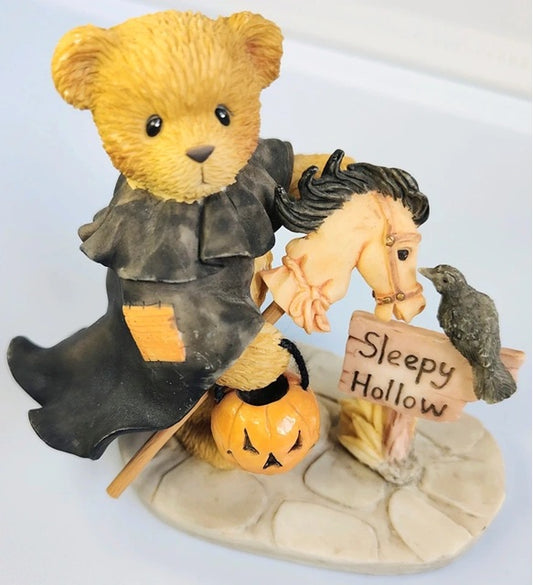 Halloween-themed  Cherished Teddies teddy bear and horse figurine with a sign and pumpkin on a white background