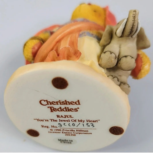 Back view of a teddy bear figurine with 'Cherished Teddies' branding on a white background.