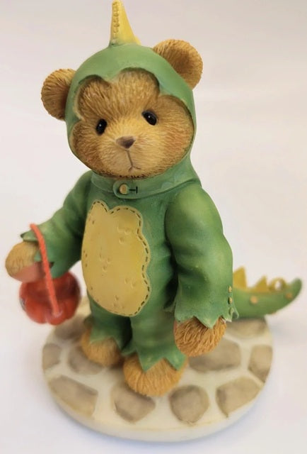 Cherished Teddies Rex teddy bear figurine in a green dinosaur costume on a white background. Halloween collection.
