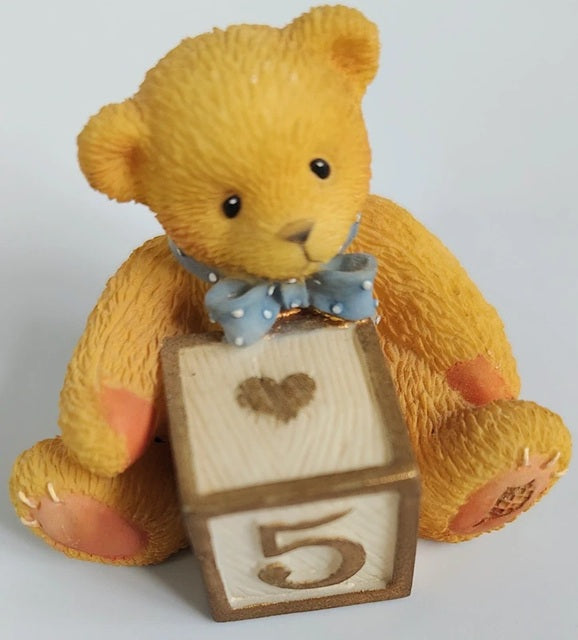 Cherished Teddies Block number 5 Age teddy bear holding a wooden block with the number 5 and a heart on a light gray background