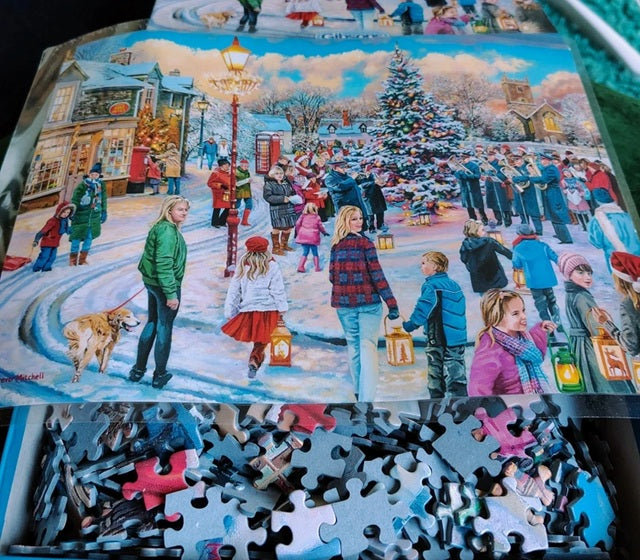 Christmas-themed puzzle with completed pieces and missing ones on a table