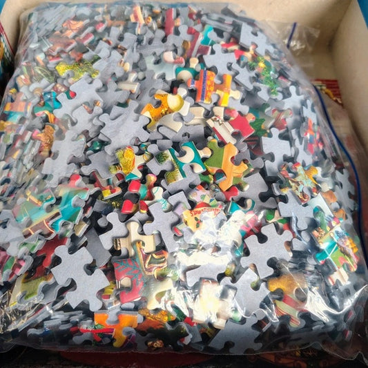 Pile of colorful puzzle pieces in a clear plastic bag