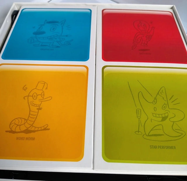 Four colorful card holders with cartoon illustrations on a white background