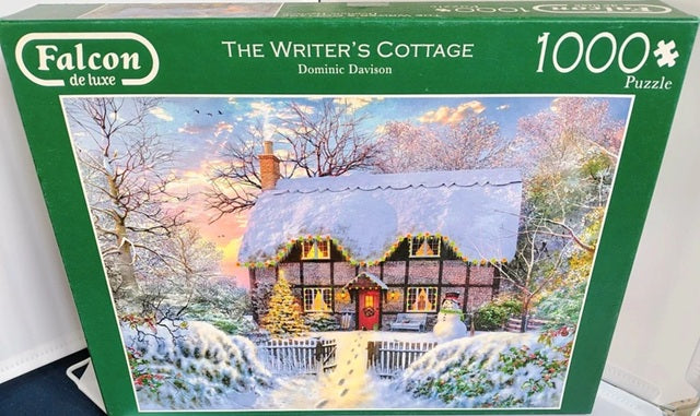 Falcon de luxe puzzle box titled 'The Writer's Cottage' with a snowy scene on the cover.