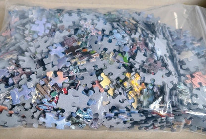 Jigsaw puzzle pieces in a clear plastic bag