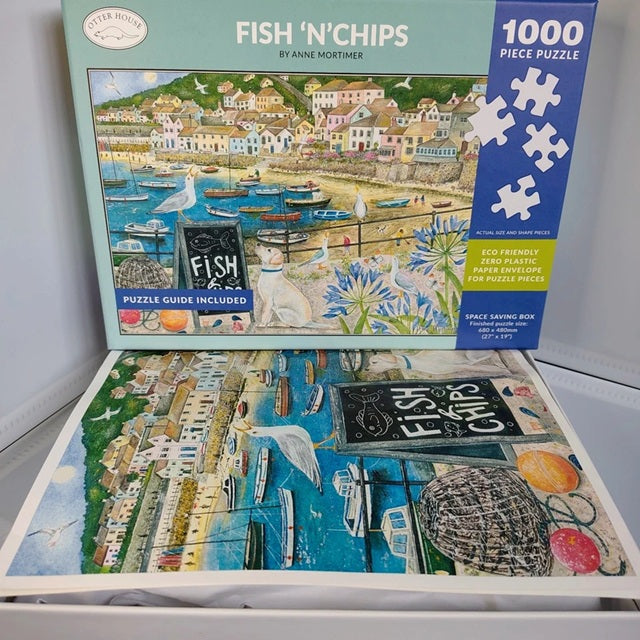 Jigsaw puzzle box for 'Fish 'n' Chips' by Anne Mortimer with a scenic illustration on the cover.