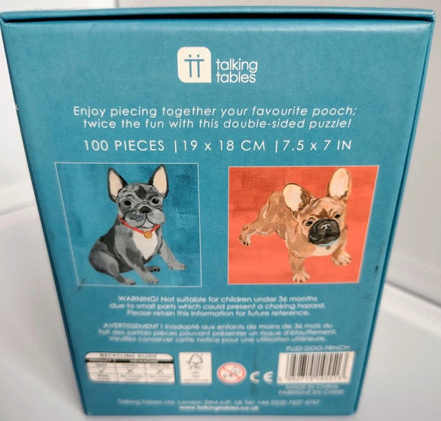 Back of a puzzle packaging with two dog illustrations and product details.