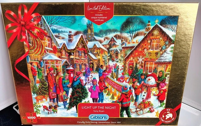 Gibsons Christmas puzzle box with a festive scene and red ribbon