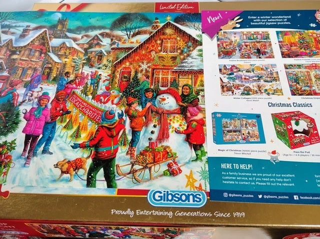 Gibsons Christmas puzzle box with a colorful winter scene and snowman.