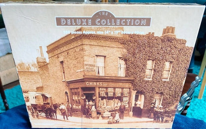 Box labeled 'The Deluxe Collection' with an image of a historical building and people.