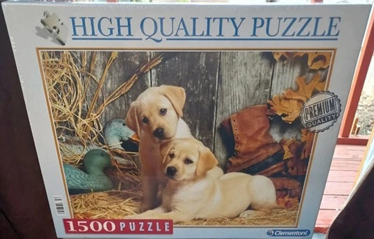 Jigsaw puzzle box with two puppies and a duck on a wooden background