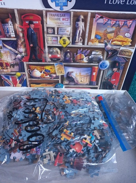 Jigsaw puzzle with bagged pieces.