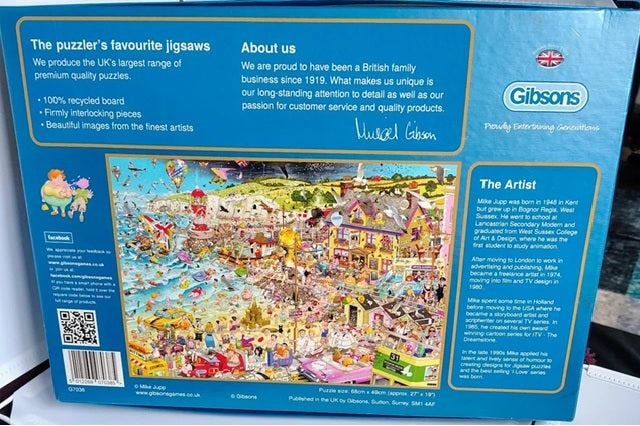 Gibsons puzzle box with a colorful illustration of a town scene and branding details.