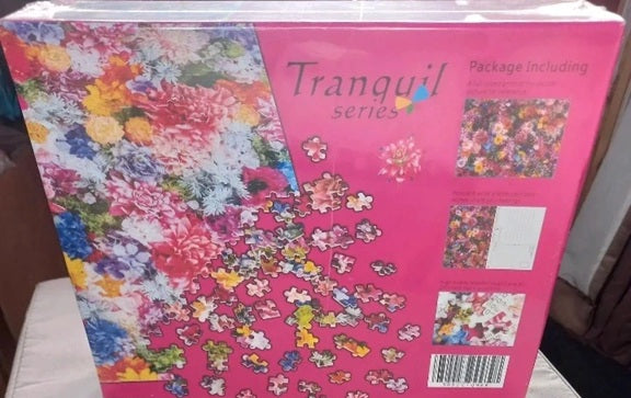 Jigsaw puzzle box with colorful floral design and 'Tranquil series' branding.