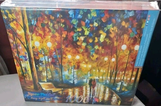 Jigsaw puzzle box with colorful forest design and '1000' pieces visible