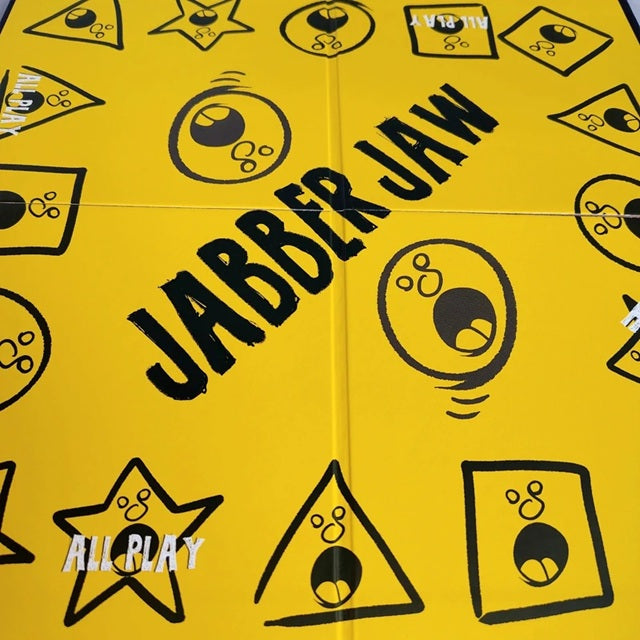 Yellow game board with black 'Jabber Jaw' branding and icons.
