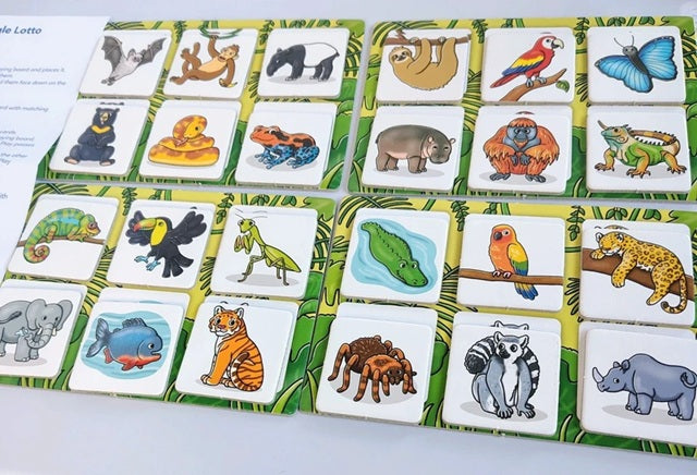 Set of animal-themed tiles on a green border with a book on the left side.