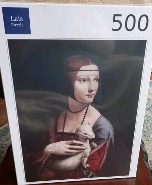 Jigsaw puzzle box featuring a portrait with 'Lais Puzzle' branding and '500' pieces.