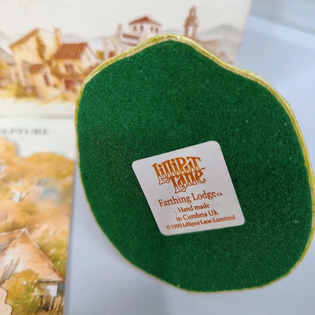 Green felt product with a label on a blurred background