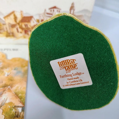 Green felt product with a label on a blurred background
