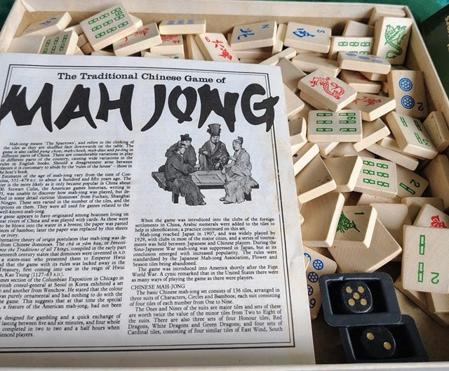Mahjong game set with instructions on a white background