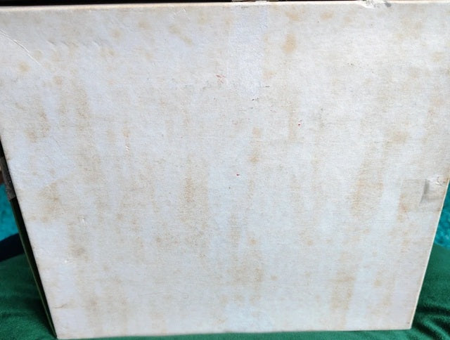 Beige marble slab on a green background