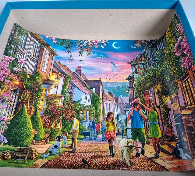 Colorful illustration of a village scene with people and dogs.