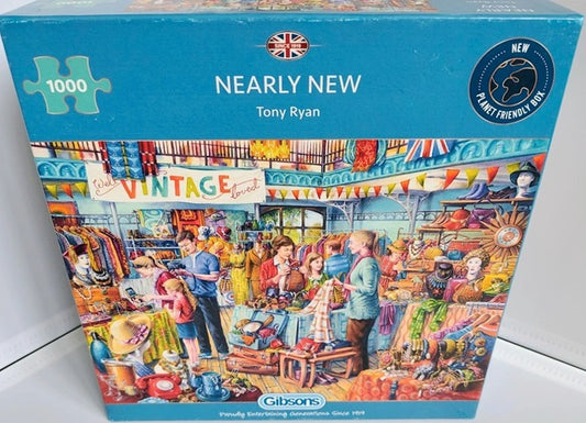 Nearly New 1000 Piece Jigsaw puzzle box with colorful illustration of a market scene and 'Gibsons' branding.