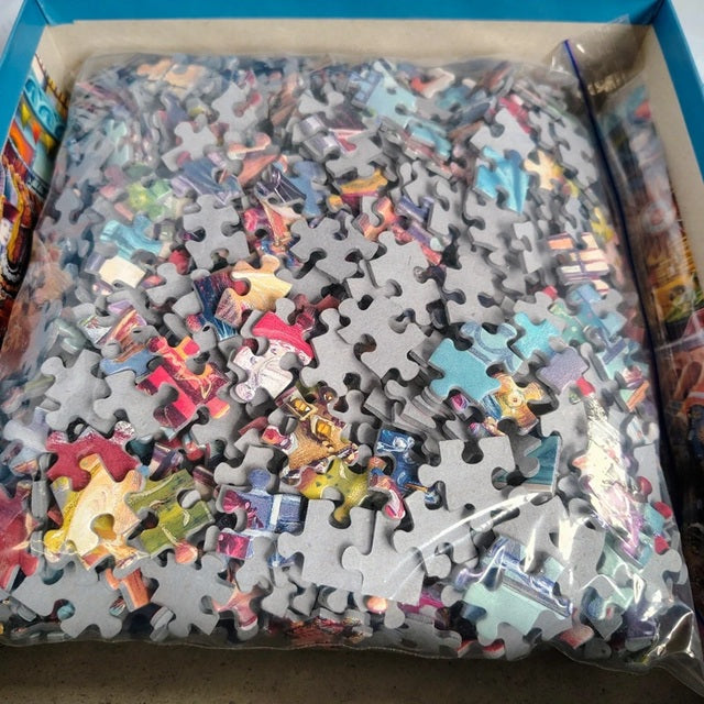 Jigsaw puzzle with colorful pieces partially assembled in a box