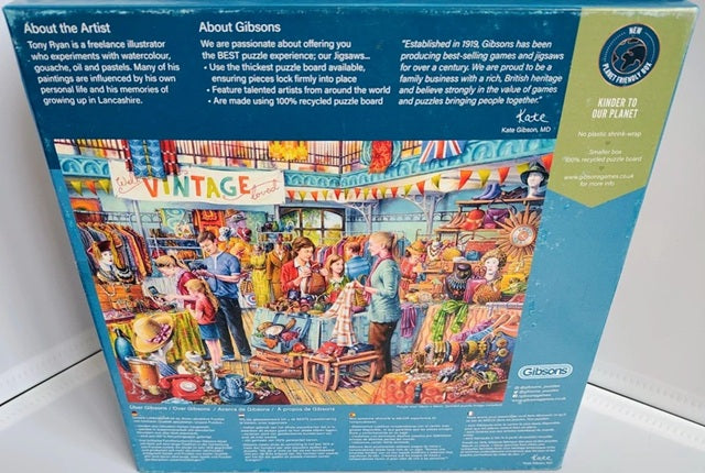 Gibsons puzzle box with colorful illustration of a vintage fair on a blue background