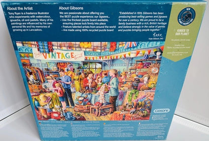 Gibsons puzzle box with colorful illustration of a vintage fair on a blue background