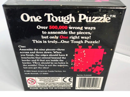 Back of a puzzle box with text and a red puzzle piece illustration on a black background.
