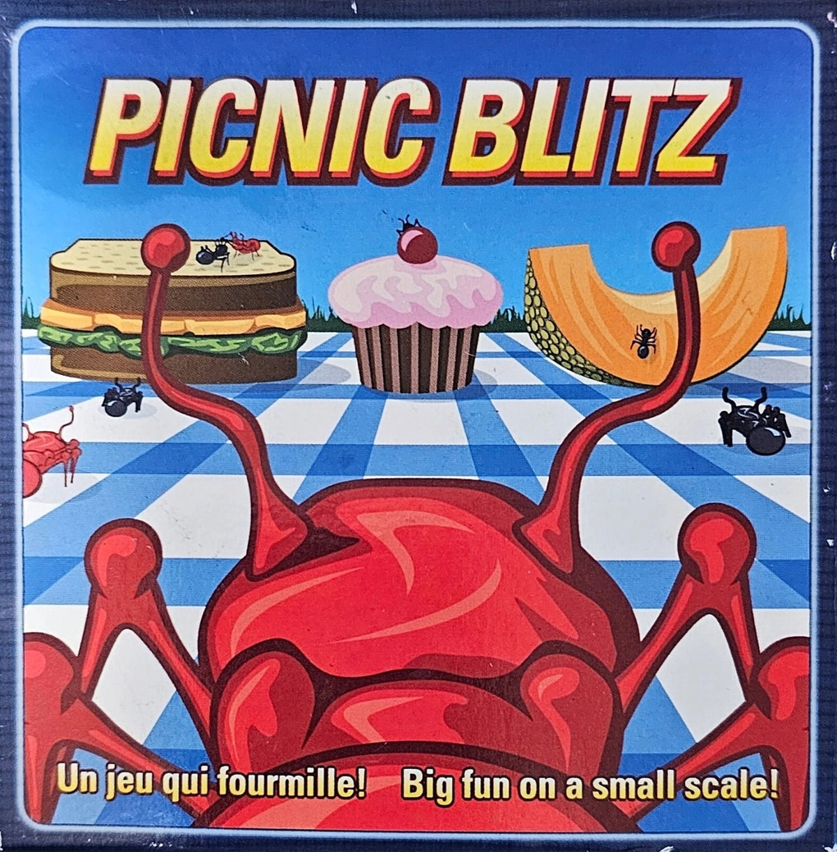 Game box for 'Picnic Blitz' with cartoon ants and food items on a checkered background.