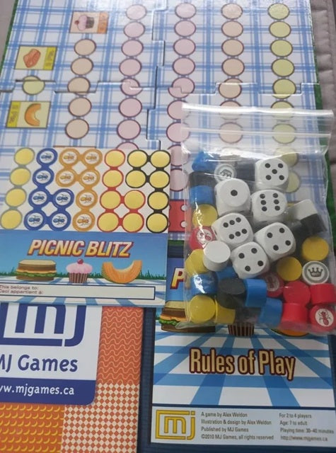 Board game components including dice and rules sheet on a colorful mat with MJ Games branding.
