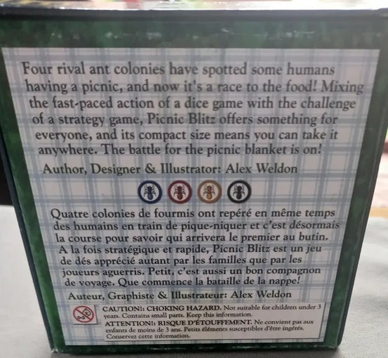 Back of a board game box with text and graphics, featuring Alex Weldon's name.