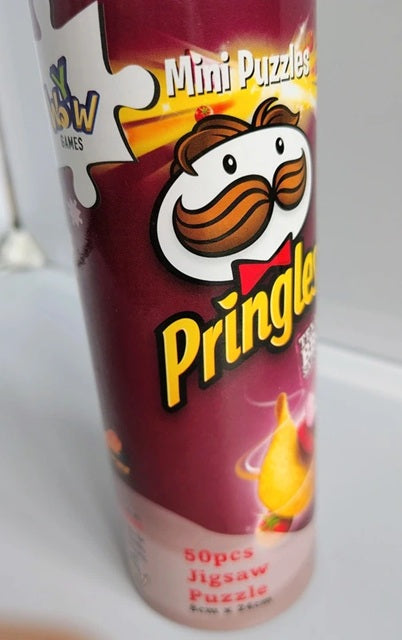 Pringles packaging with mini puzzles on a white background