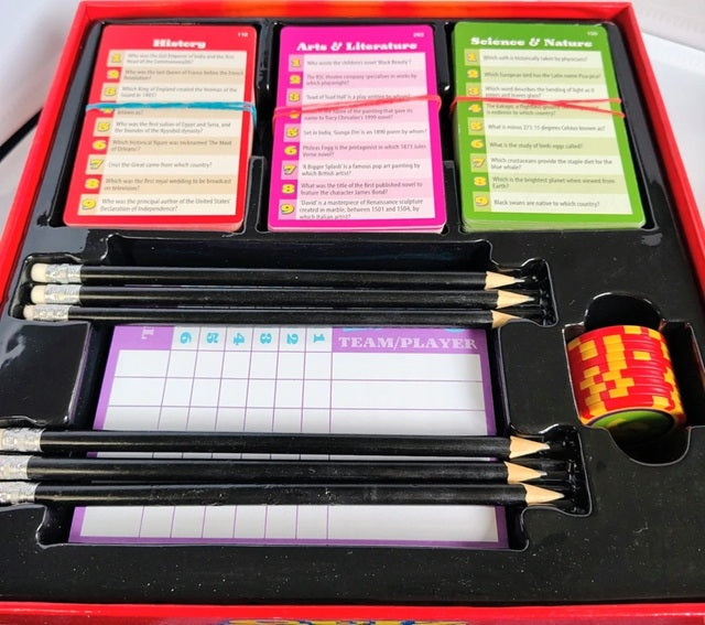 Educational game set with cards, pencils, and a timer in a red box.