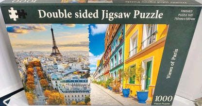 Double-sided jigsaw puzzle box featuring images of Paris with the Eiffel Tower and colorful street scenes.