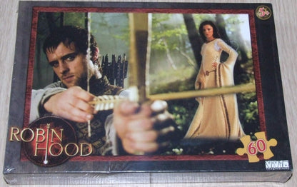 Jigsaw puzzle box featuring images of a man and woman in medieval attire with 'Robin Hood' branding.