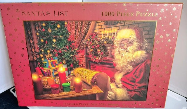 Jigsaw puzzle box featuring a Christmas scene with Santa Claus.
