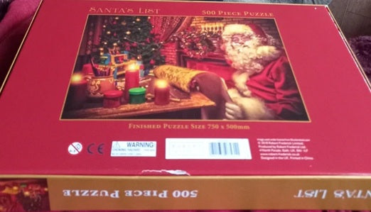 Jigsaw puzzle box with Santa Claus and Christmas-themed design