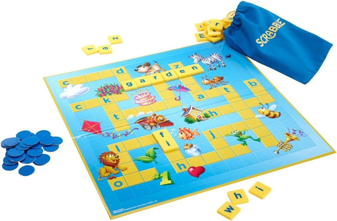 Scrabble board game with tiles and bag on a white background